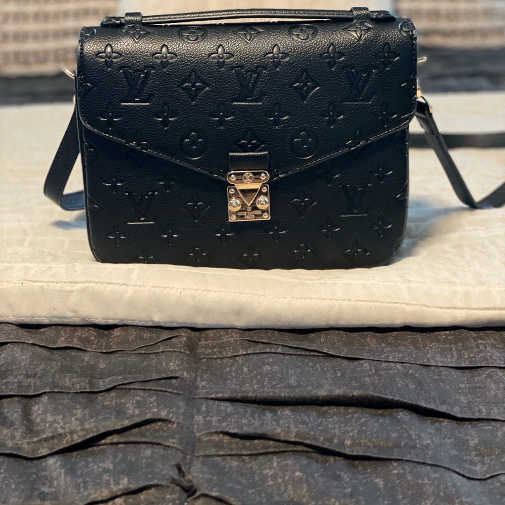 Luxury, and luxurious black bag.